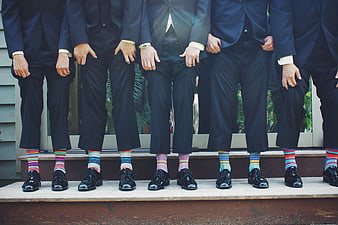 Groomsmen Wearing Colorful Striped Socks in Suits