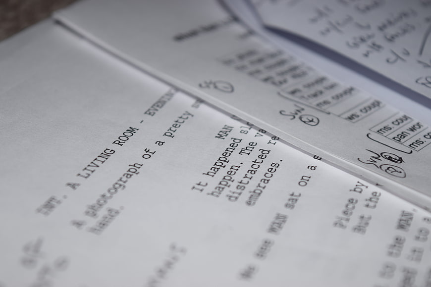 Close-up of screenplay pages with handwritten notes and edits