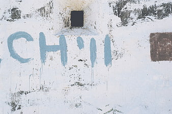 Textured white wall with blue graffiti and grunge details