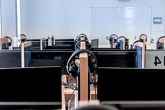 Modern Computer Lab with Headsets and Monitors