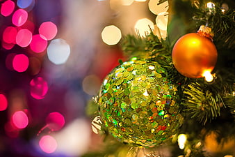 Close-up of Glittery Green and Gold Christmas Ornaments