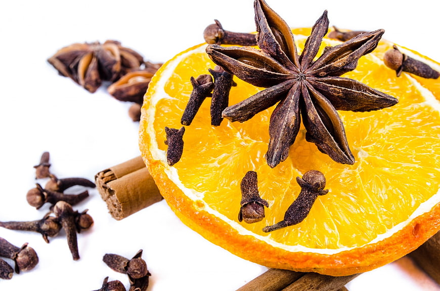 Star Anise, Cloves, and Cinnamon Sticks on Orange Slice