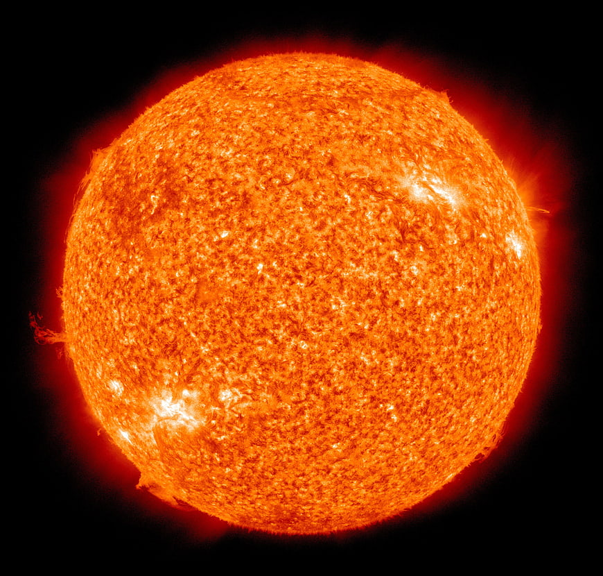 Vibrant Orange Sun Surface Texture on Black Background