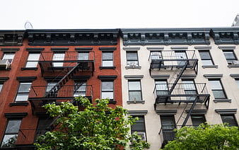 Red and White Brick Apartment Buildings with Fire Escapes