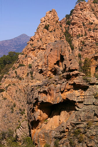 Dramatic Red Rock Cliffs in Corsica Landscape