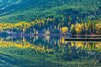 Serene Lake with Vibrant Autumn Forest Reflections