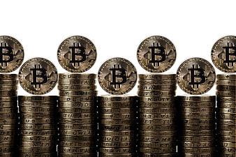 Stacks of Gold Bitcoin Coins on White Background