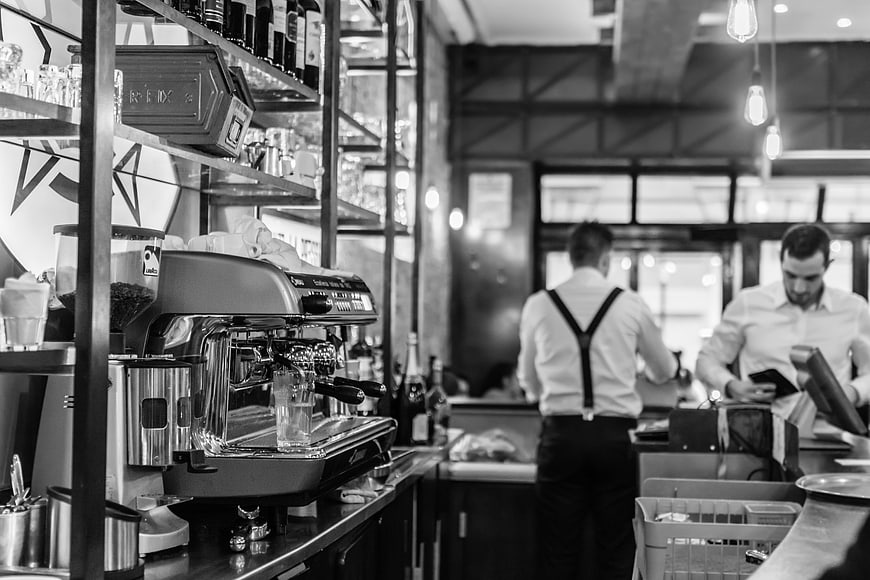 Baristas Working in a Modern Industrial Style Coffee Shop