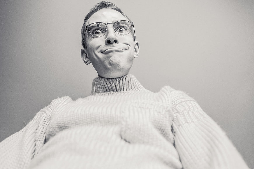Funny low angle portrait of man making silly face