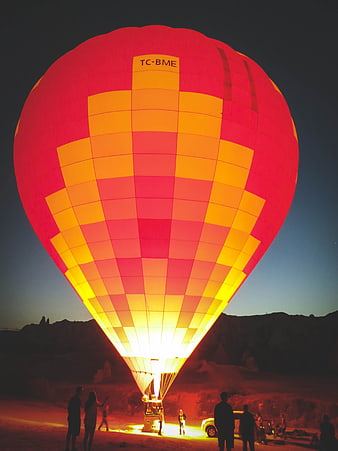 Glowing Hot Air Balloon Inflating at Dusk in Cappadocia
