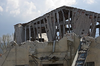 Collapsed concrete building structure after earthquake disaster