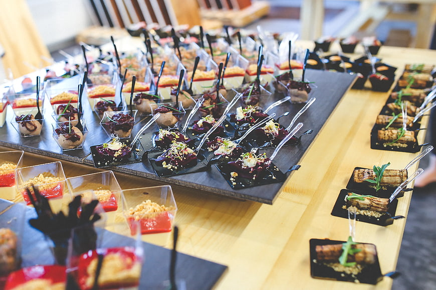 Assorted gourmet appetizers and desserts on a buffet table
