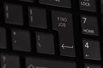 Close-up of black keyboard with 'Find Job' enter key