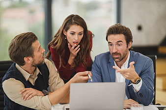 Business team discussing strategy in modern office meeting