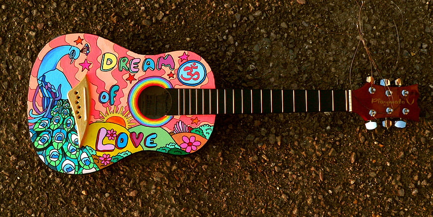 Colorful hand-painted ukulele with peacock and dream of love design