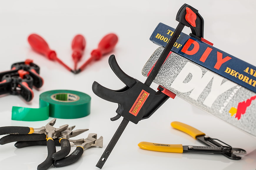 DIY Tools And Books On White Background