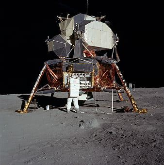 Astronaut standing in front of Lunar Module on the Moon surface