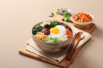 Traditional Korean Bibimbap with Fried Egg and Kimchi