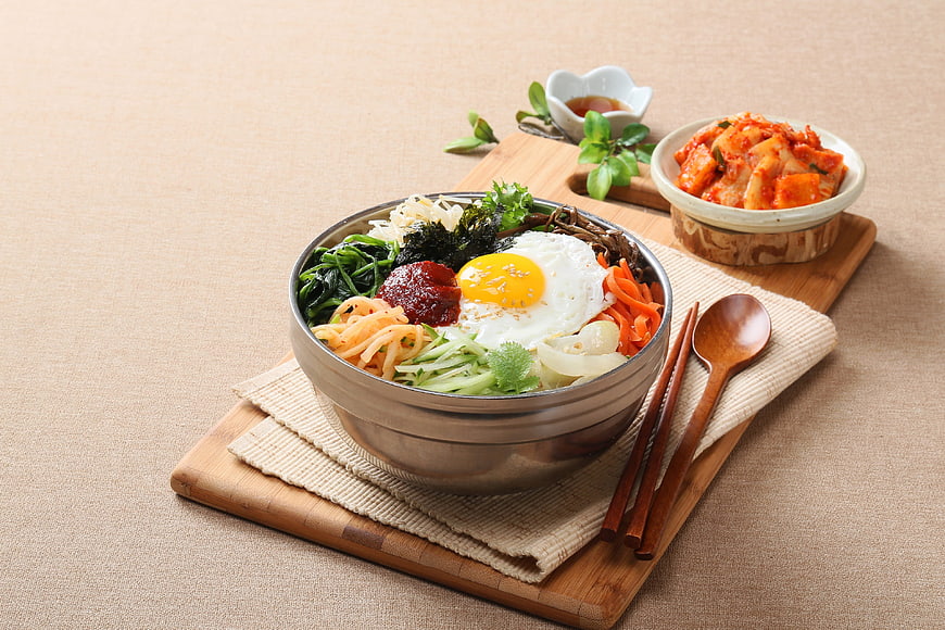Traditional Korean Bibimbap with Fried Egg and Kimchi
