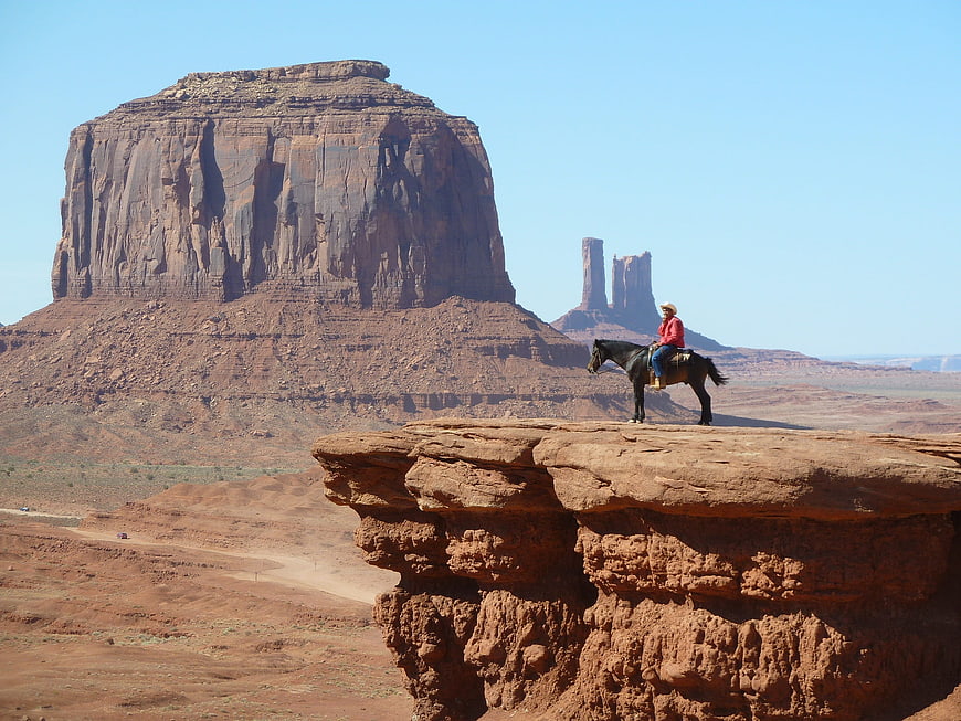 Cowboy on Horseback in Monument Valley Desert Landscape