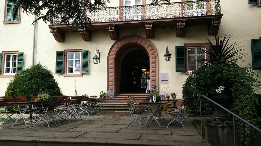 Historic European Castle Courtyard with Outdoor Cafe Seating