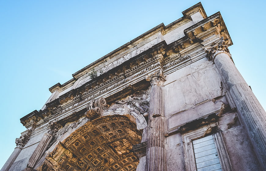 Low angle view of ancient Roman triumphal arch architecture