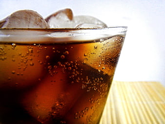 Close-up of Iced Cola with Bubbles and Ice Cubes