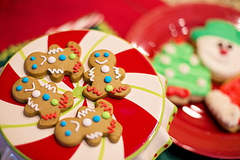 Decorated Gingerbread Men Cookies on Festive Red and White Plate