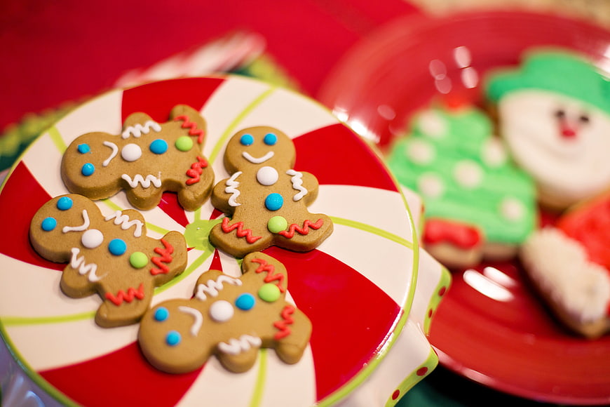 Decorated Gingerbread Men Cookies on Festive Red and White Plate