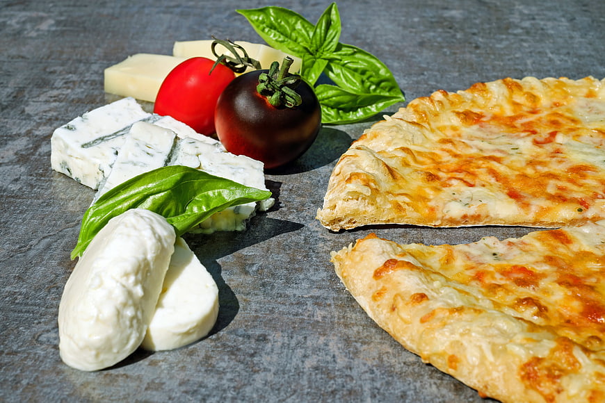 Fresh Pizza Slices with Mozzarella, Blue Cheese, and Tomatoes