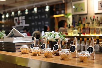Elegant cafe table setting with white flowers and books