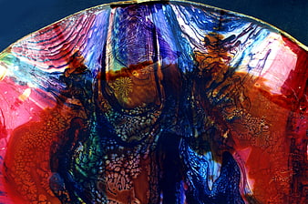 Abstract colorful glass texture with red and blue swirls