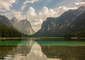 Scenic mountain lake with turquoise water and dramatic clouds