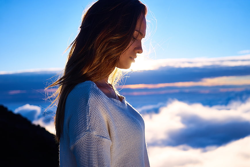 Woman in White Sweater Looking at Mountain Clouds