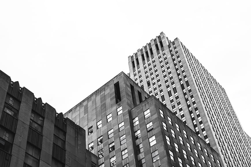 Black and white low angle view of urban skyscrapers