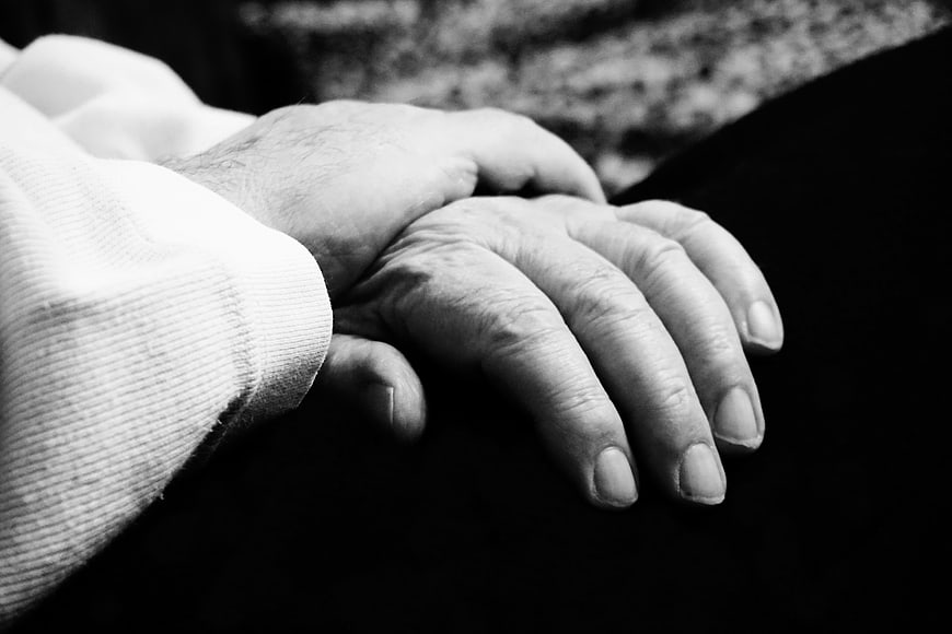Black and White Close Up of Elderly Hands Holding Each Other