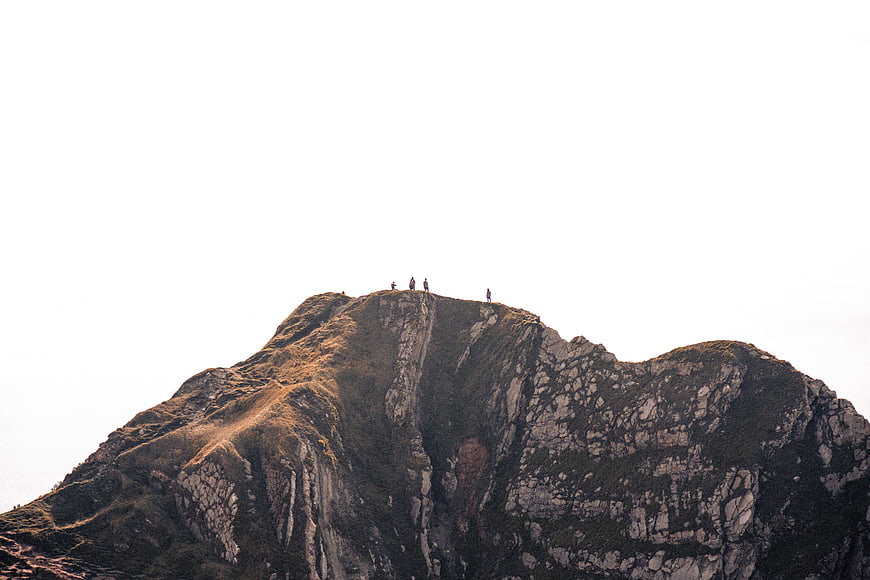 Hikers on Rocky Mountain Peak with Large Copyspace