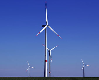 Wind Turbines Against Clear Blue Sky Renewable Energy Landscape