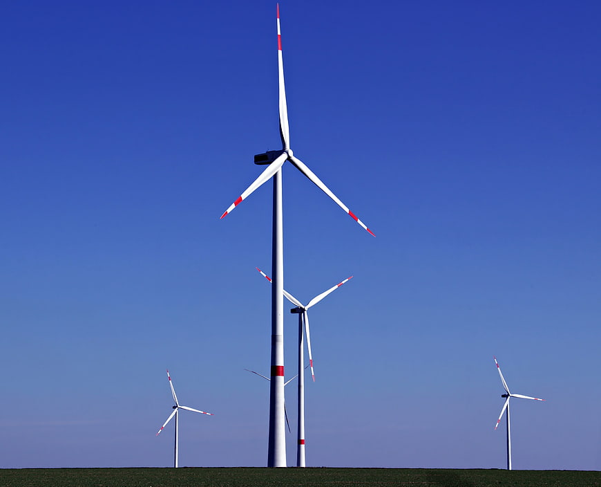 Wind Turbines Against Clear Blue Sky Renewable Energy Landscape