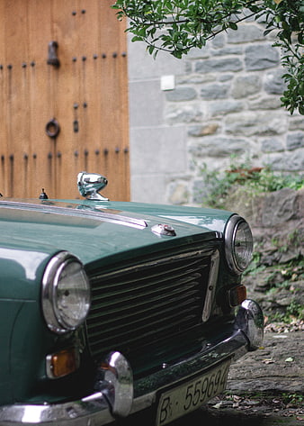 Close-up of vintage green classic car front grille