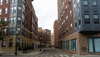 Deserted Urban Street Between Modern Brick Buildings