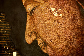 Close-up of Golden Buddha Face Mural with Gold Leaf