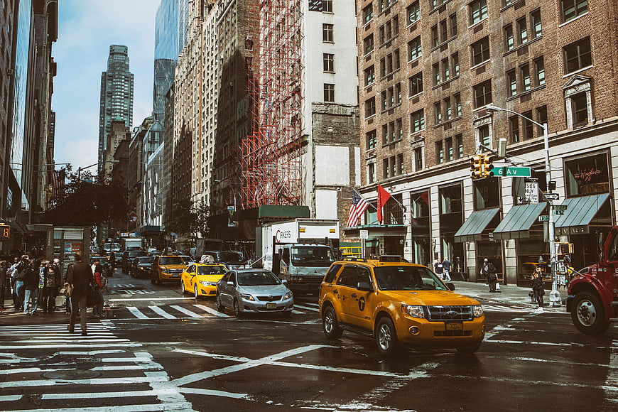 Busy New York City street scene with yellow taxis