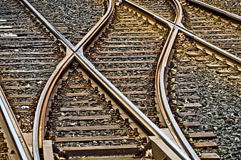 High angle view of intersecting railroad tracks and gravel