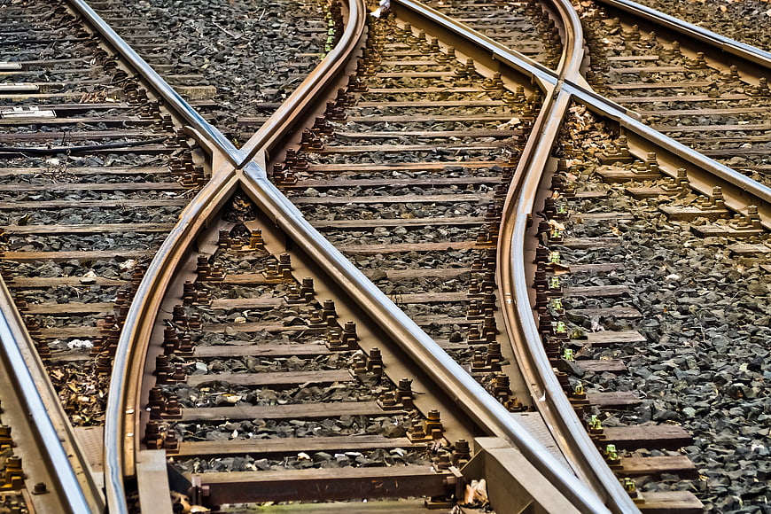 High angle view of intersecting railroad tracks and gravel
