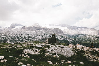 Small stone chapel in rocky alpine mountain landscape