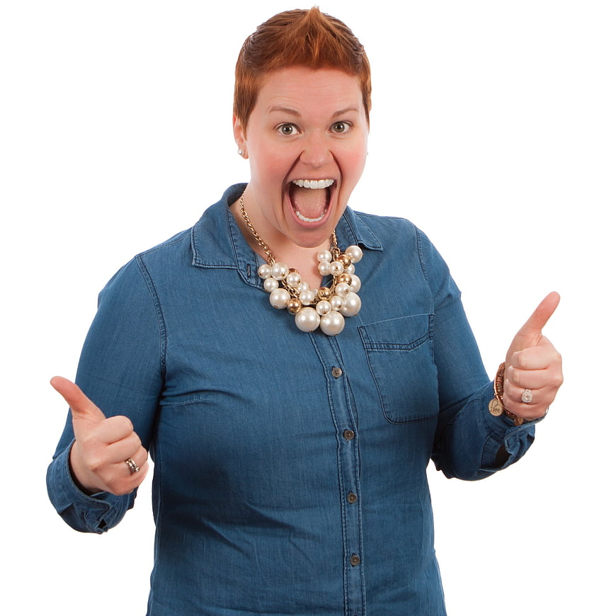Excited woman with short red hair giving double thumbs up