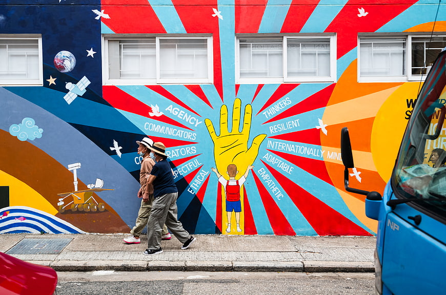Colorful Street Art Mural with Walking Pedestrians