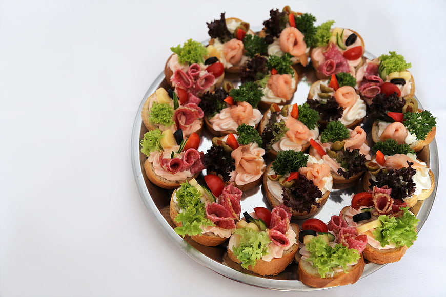 Assorted Canapés on Silver Platter with White Background