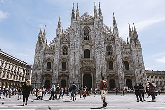 Duomo di Milano Cathedral Facade with Tourists in Piazza del Duomo